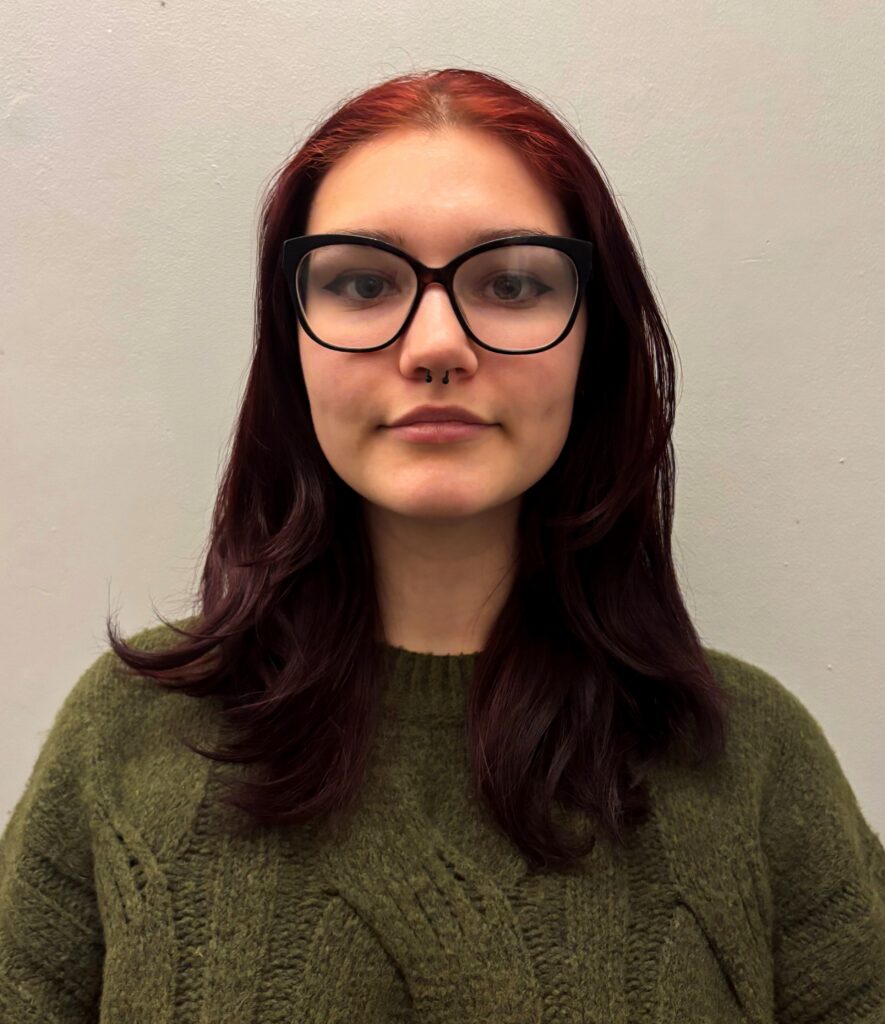 Female studetn with glasses smiling