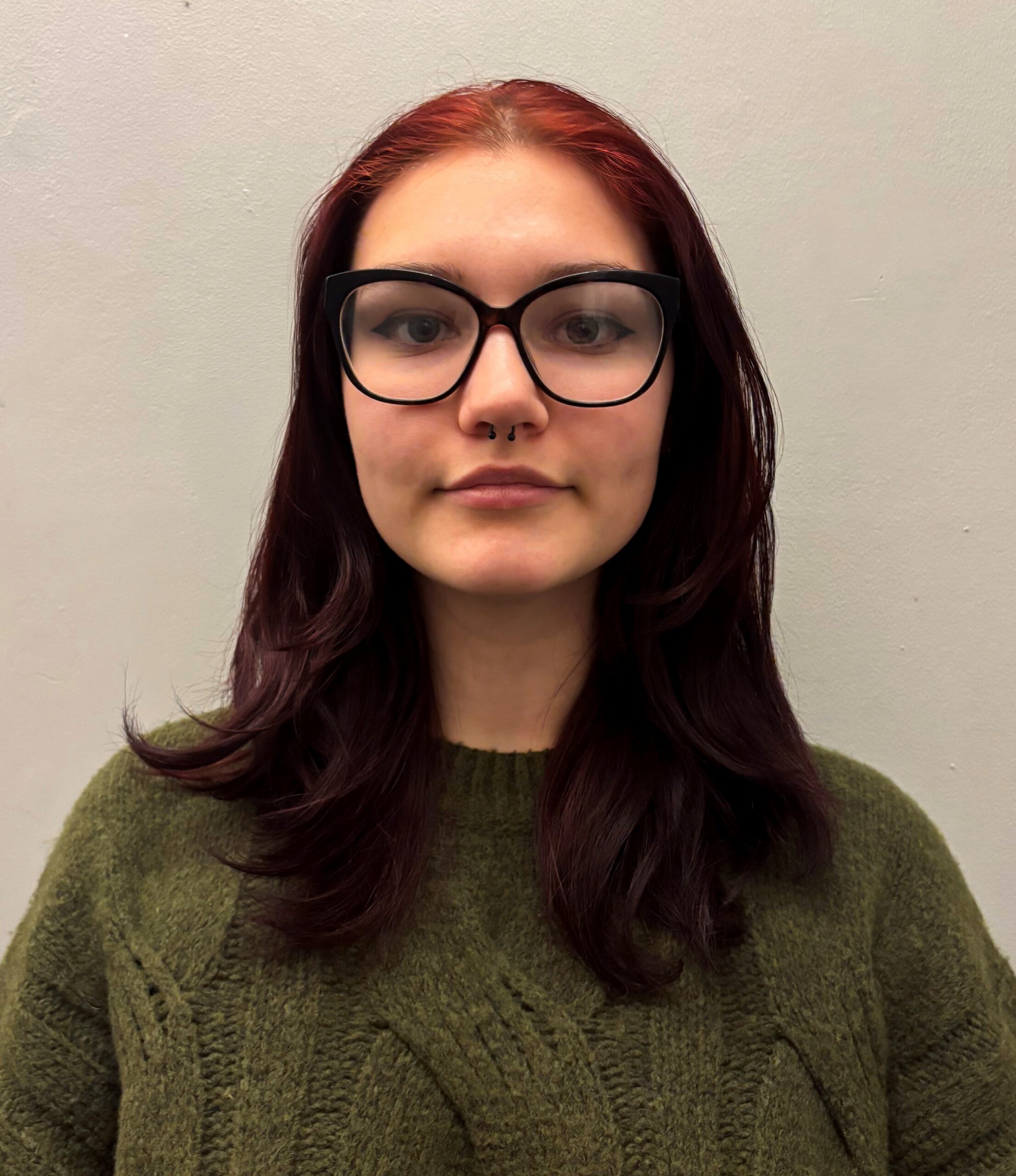 Female studetn with glasses smiling