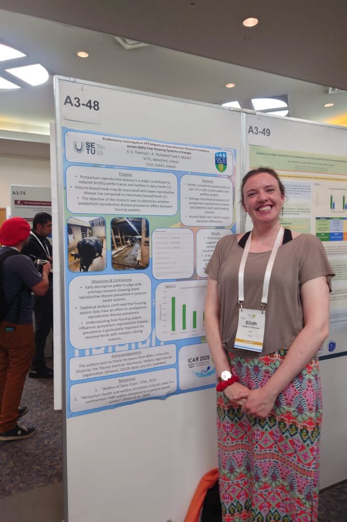 Female standing in front of research poster
