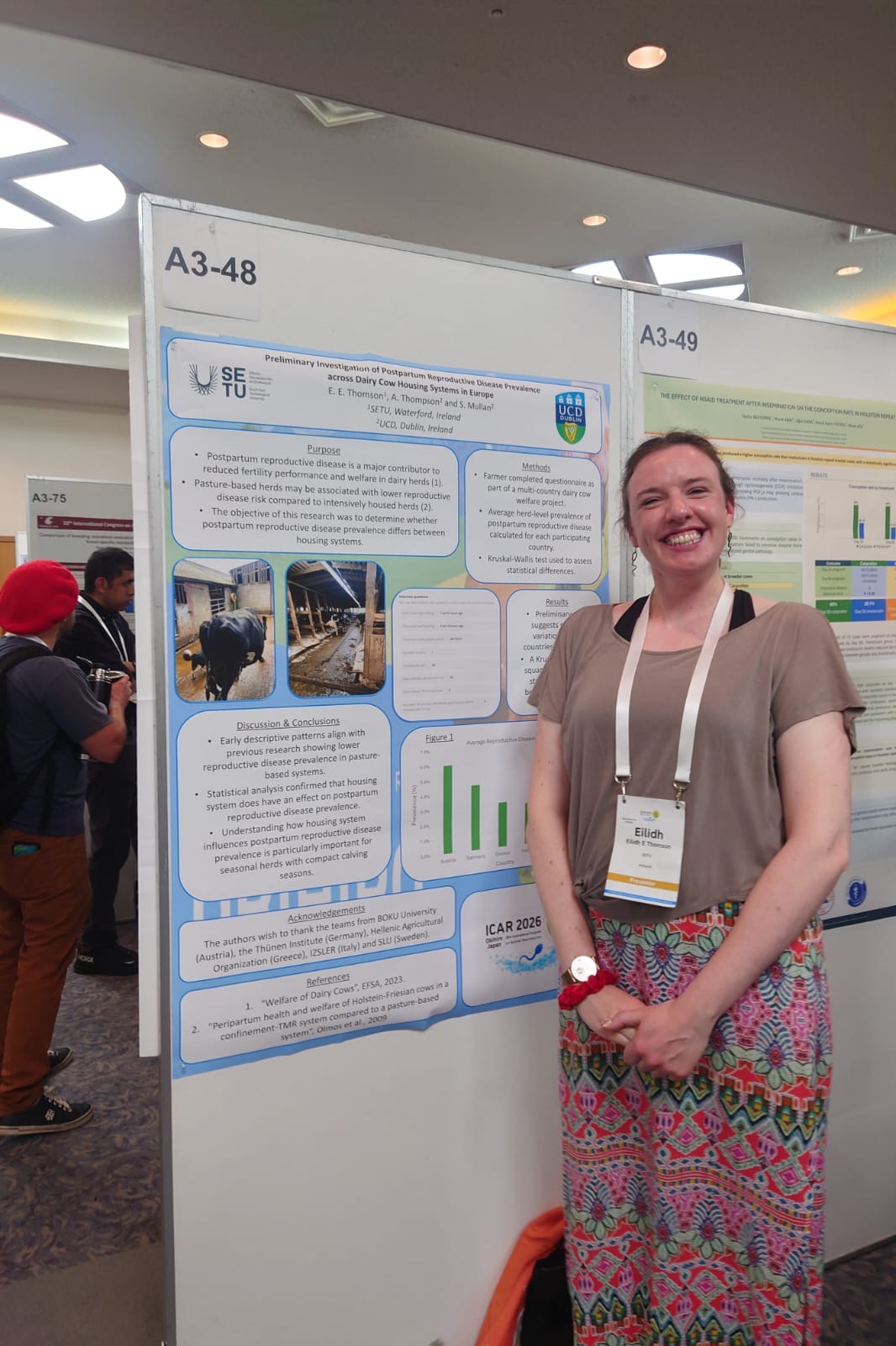 Female standing in front of research poster